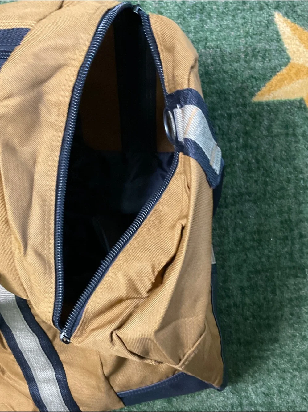 NRA SYMBOL Tan Canvas Duffel Bag with Navy Black Trim and Shoulder Strap